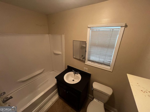 full bathroom with bathtub / shower combination, vanity, and toilet