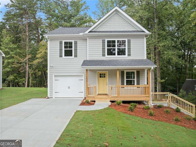 view of front of house with a front yard, a porch, and a garage