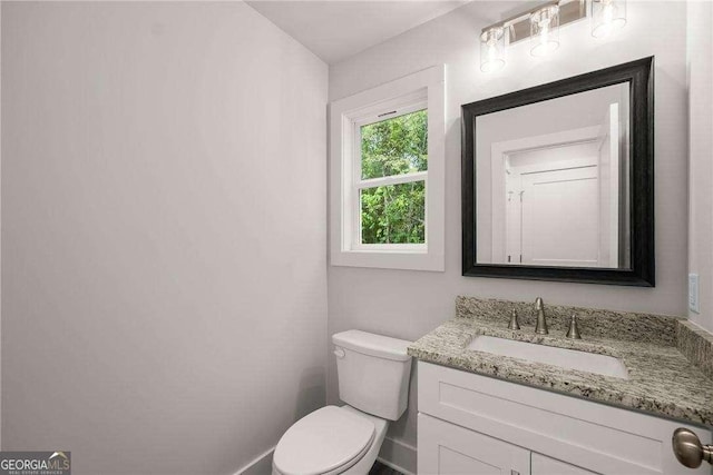 bathroom with vanity and toilet