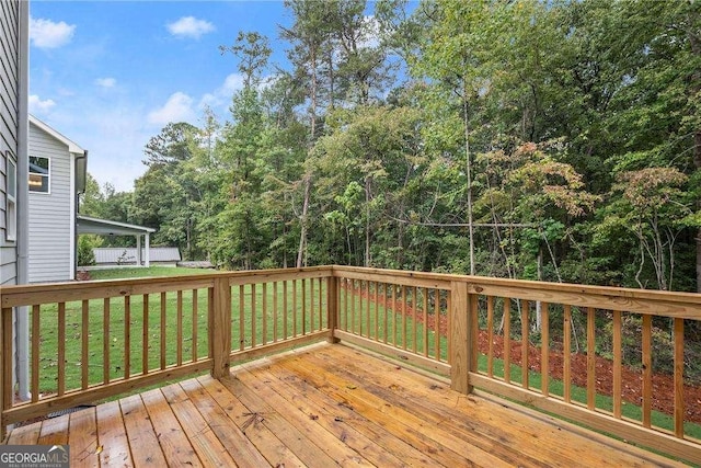 wooden deck with a lawn