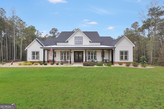 modern farmhouse style home with a porch and a front lawn