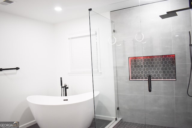 bathroom with tile patterned floors and plus walk in shower