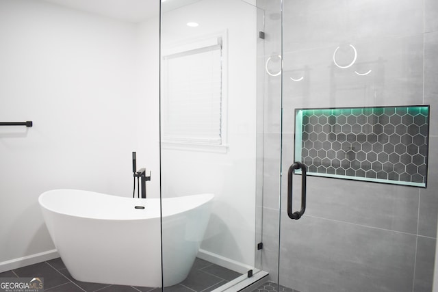 bathroom featuring tile patterned floors and plus walk in shower