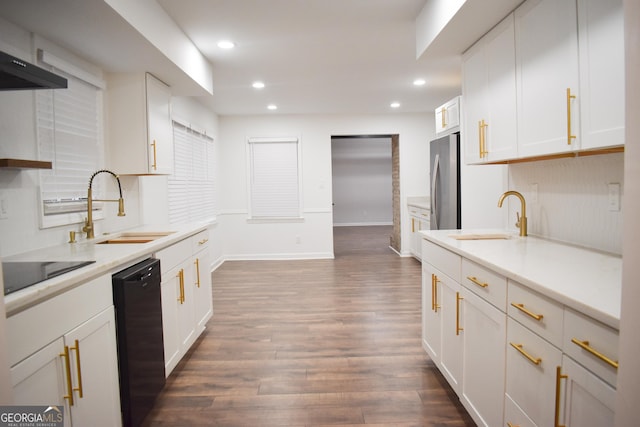 kitchen featuring white cabinetry, black appliances, and sink