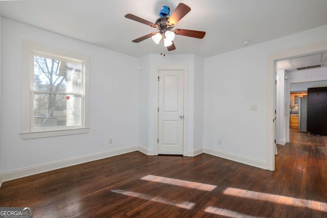 interior space featuring dark hardwood / wood-style floors and ceiling fan