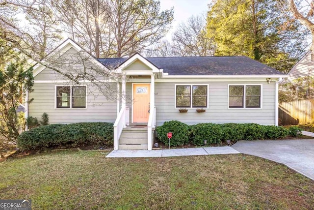 ranch-style house with a front lawn