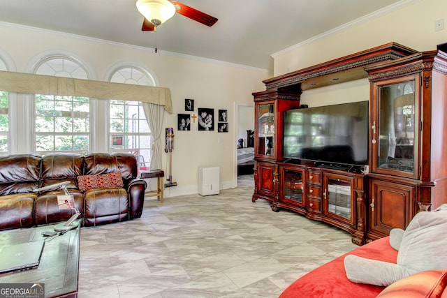 living room with ceiling fan and ornamental molding