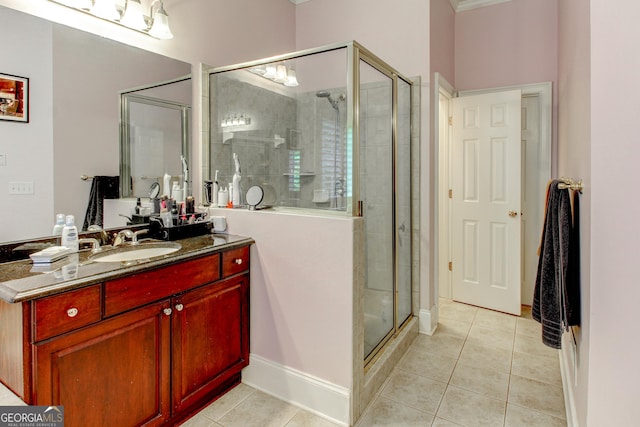 bathroom featuring vanity, tile patterned floors, and an enclosed shower