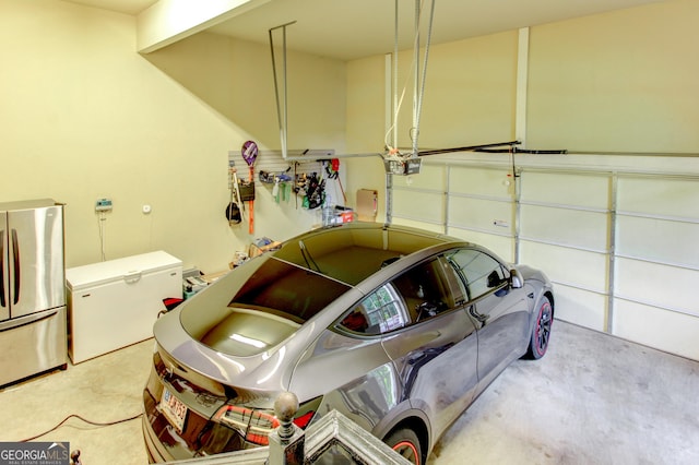 garage featuring stainless steel refrigerator and fridge