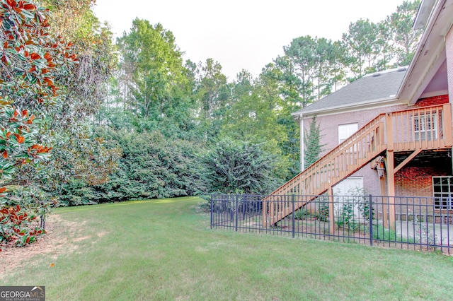 view of yard featuring a wooden deck