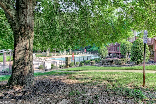 view of yard with a community pool