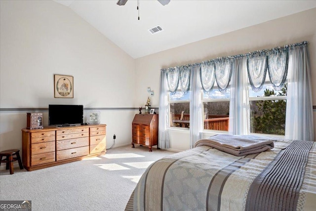 carpeted bedroom featuring ceiling fan and lofted ceiling