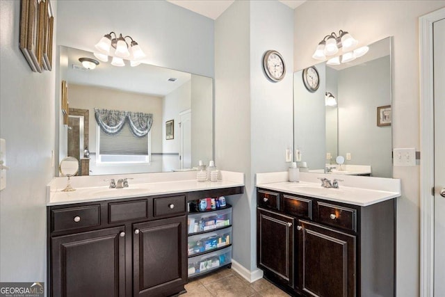 bathroom with tile patterned floors and vanity