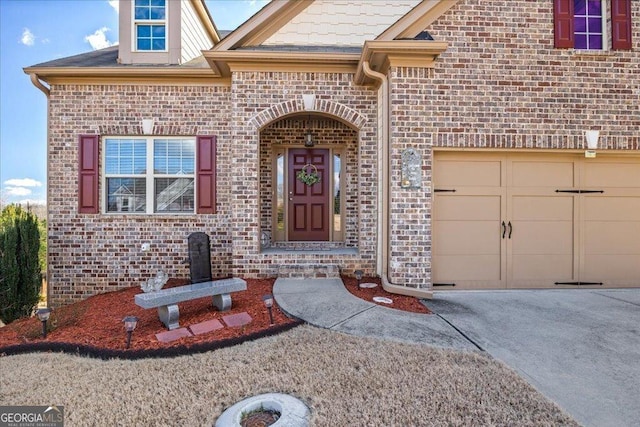 doorway to property featuring a garage