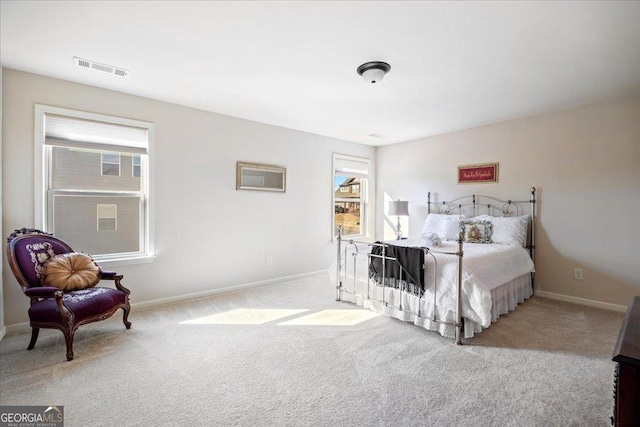 bedroom featuring light colored carpet