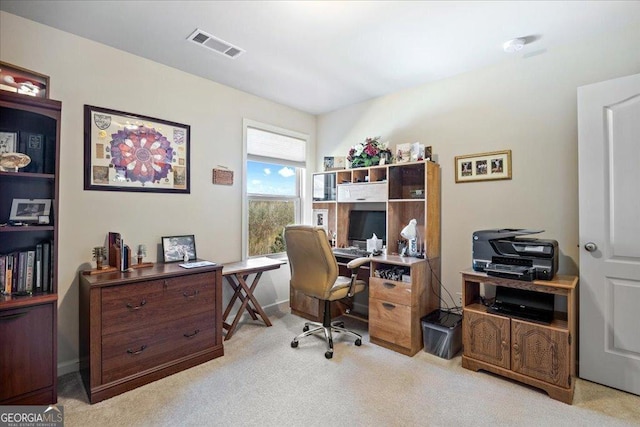 office area featuring light colored carpet