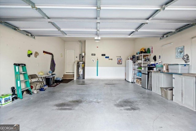 garage featuring gas water heater and a garage door opener