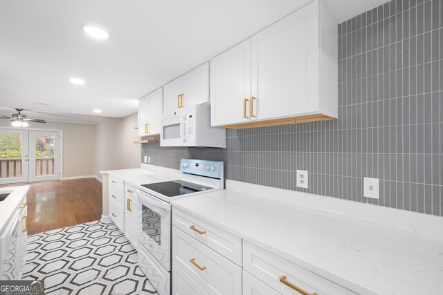 kitchen featuring white cabinetry, french doors, ceiling fan, tasteful backsplash, and white appliances