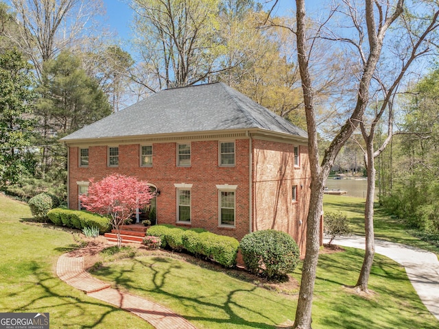 view of home's exterior with a lawn