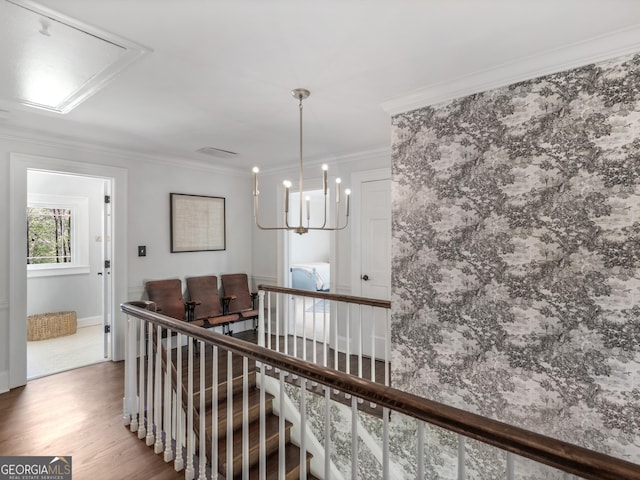 hallway with hardwood / wood-style floors and crown molding