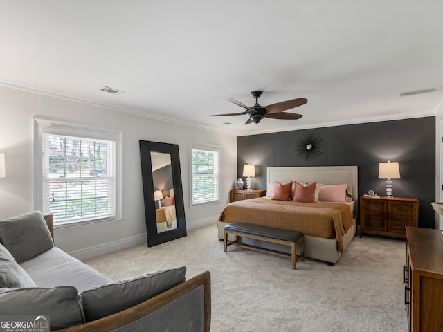 bedroom featuring ceiling fan, light colored carpet, and ornamental molding