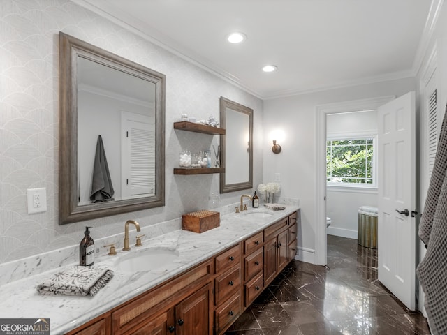 bathroom with vanity, toilet, and ornamental molding