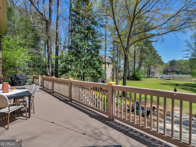 view of patio with a deck with water view