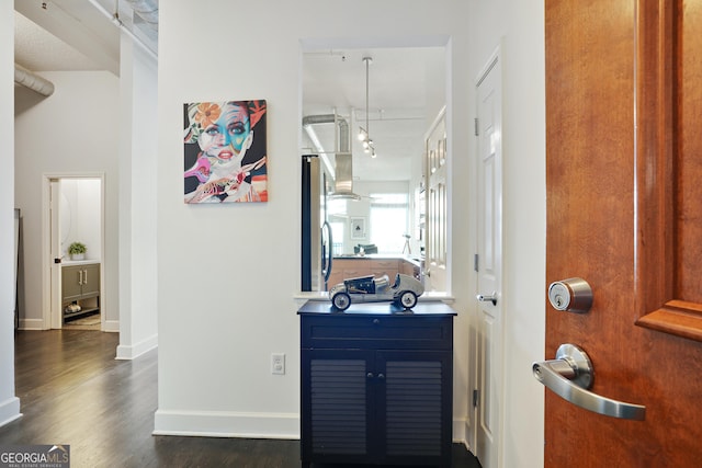 hallway with dark wood-type flooring