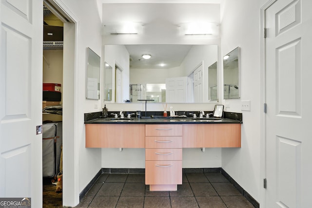 bathroom featuring tile patterned flooring and vanity