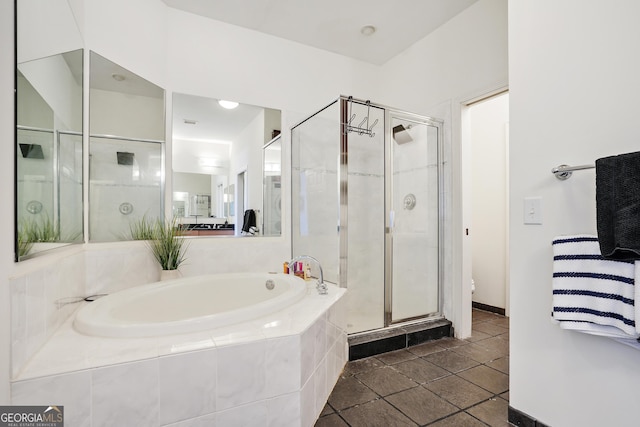 bathroom with tile patterned flooring, independent shower and bath, and toilet