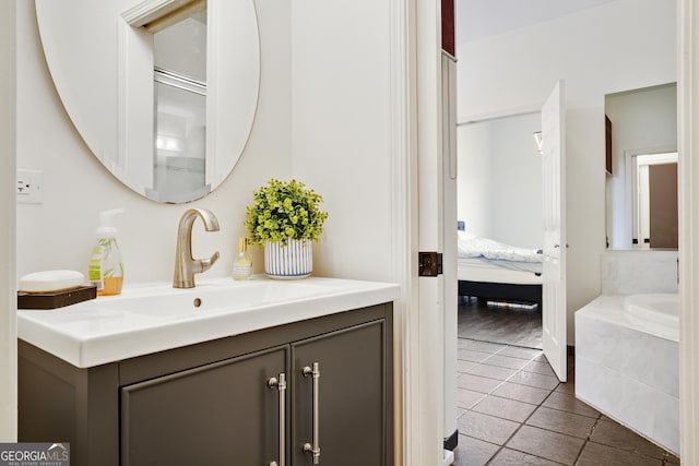 bathroom with tile patterned flooring and vanity