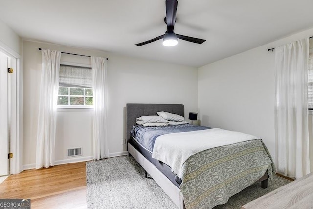 bedroom featuring ceiling fan and wood-type flooring