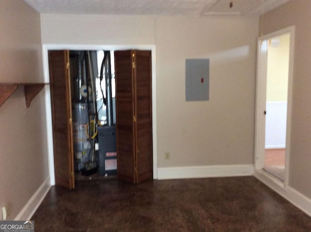 interior space with electric panel and gas water heater