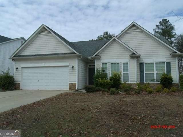 ranch-style home with a garage