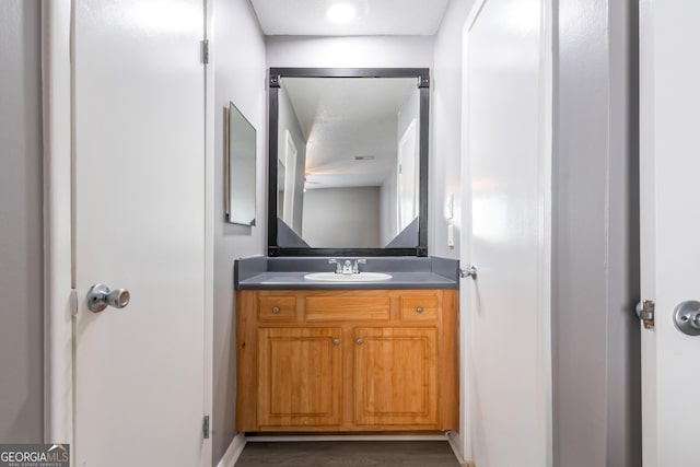 bathroom featuring vanity and ceiling fan