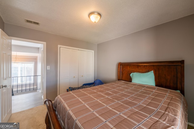 bedroom with carpet floors and a closet