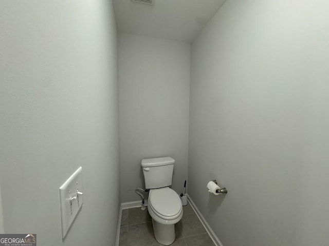 bathroom with tile patterned floors and toilet