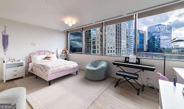 bedroom with light hardwood / wood-style flooring