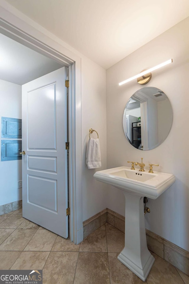 bathroom with tile patterned floors and sink