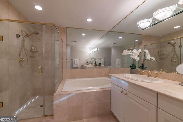 bathroom featuring vanity and plus walk in shower