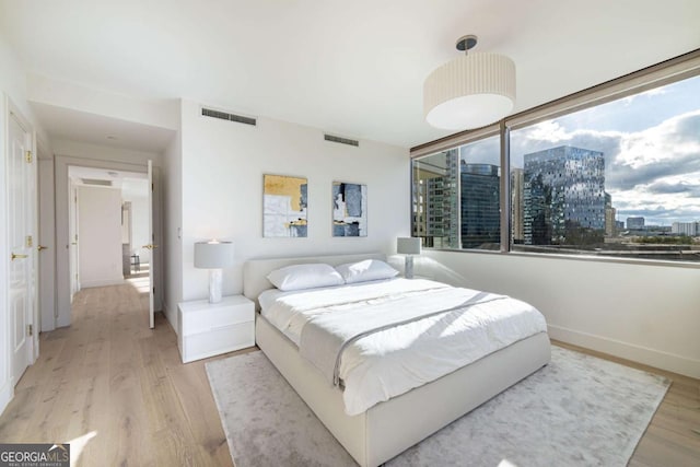 bedroom featuring light wood-type flooring