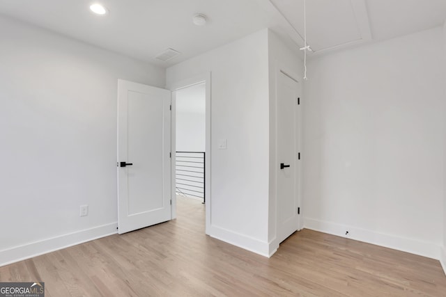 unfurnished room with light hardwood / wood-style floors