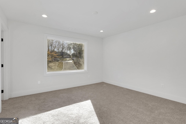 unfurnished room with carpet floors