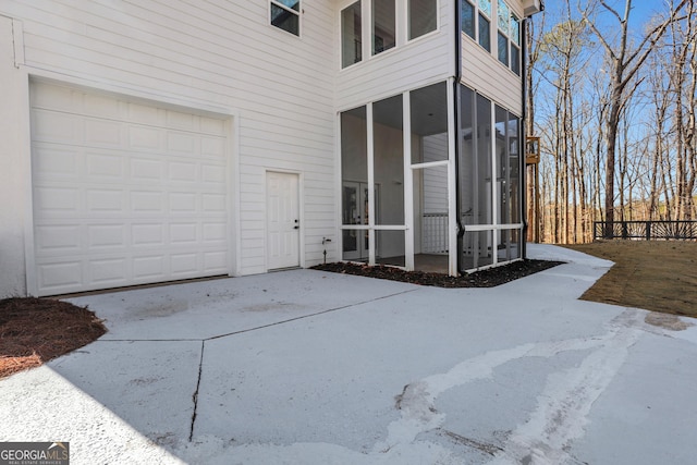 doorway to property featuring a garage