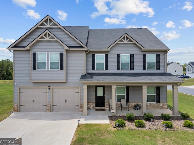 craftsman-style home with a front lawn, a porch, and a garage