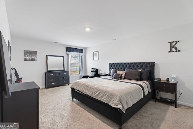 bedroom with light carpet