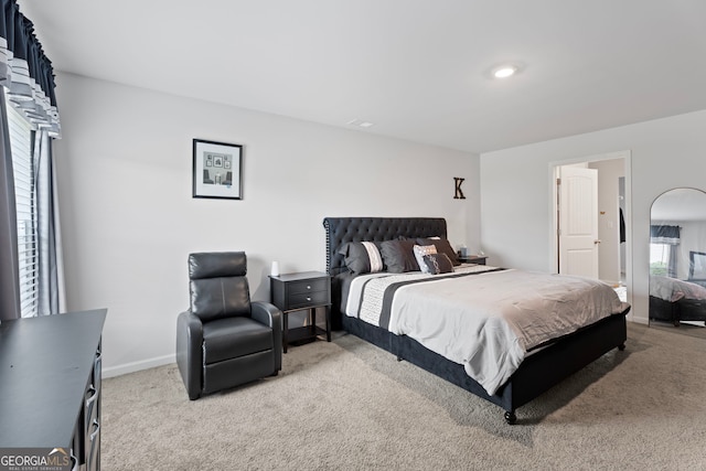 bedroom with light colored carpet