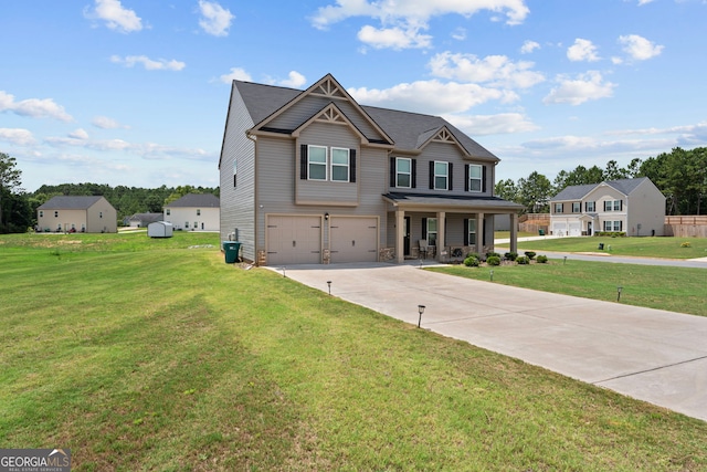 view of front of home with a porch, a garage, and a front yard