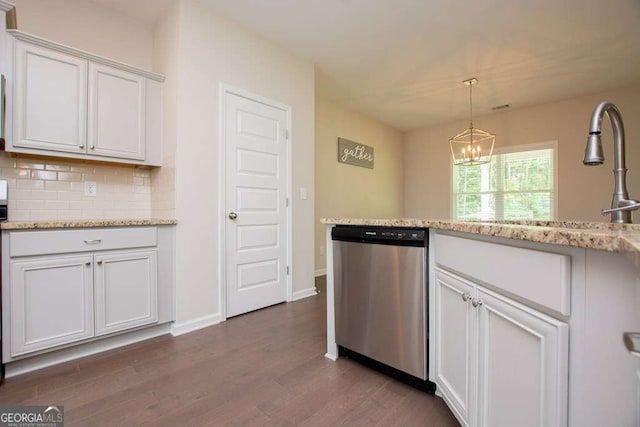 kitchen with decorative backsplash, dark hardwood / wood-style flooring, stainless steel dishwasher, light stone counters, and white cabinets