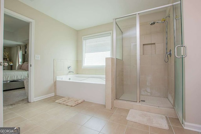 bathroom featuring tile patterned flooring and plus walk in shower